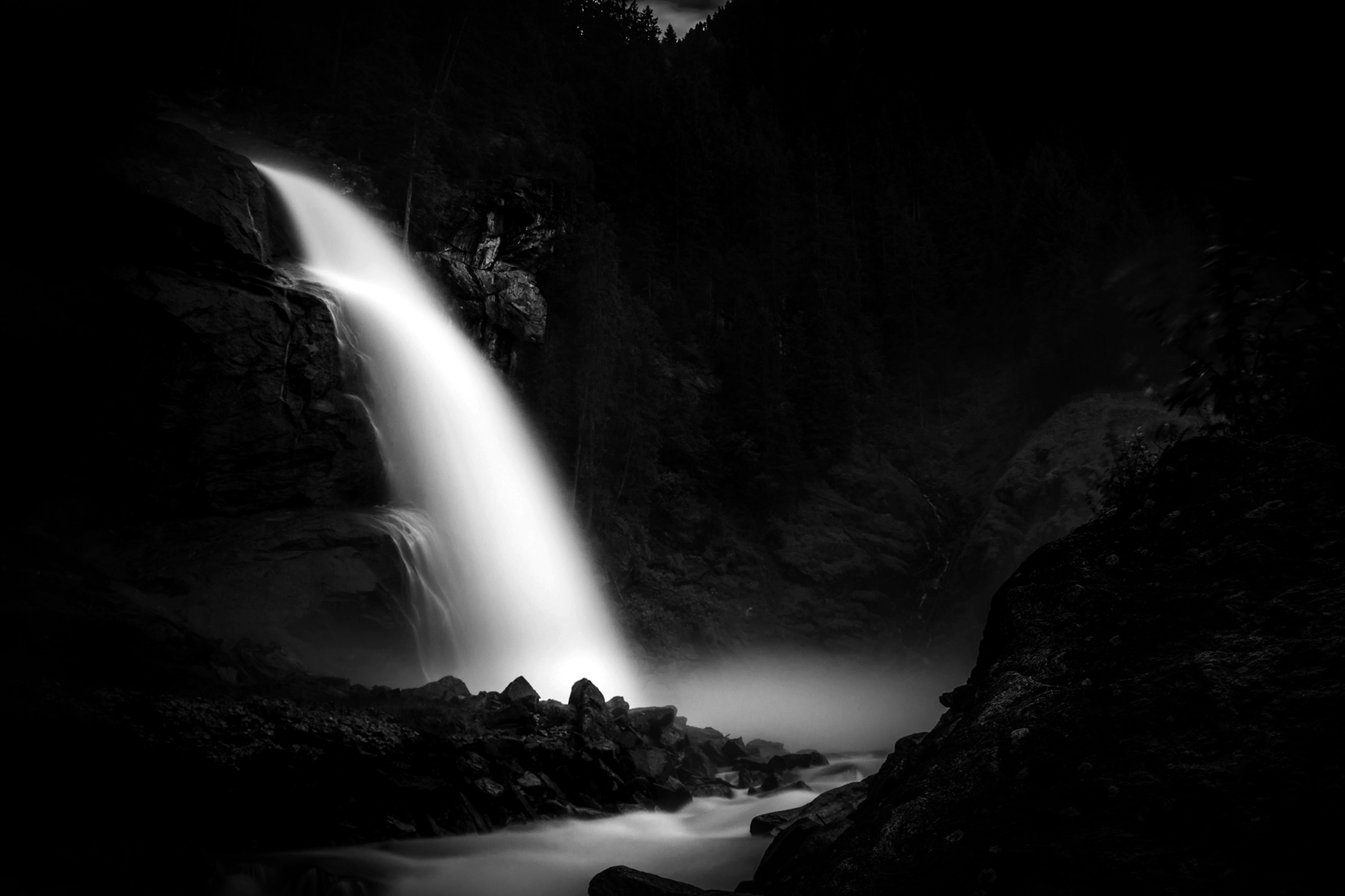 A waterfall and stream in soft focus